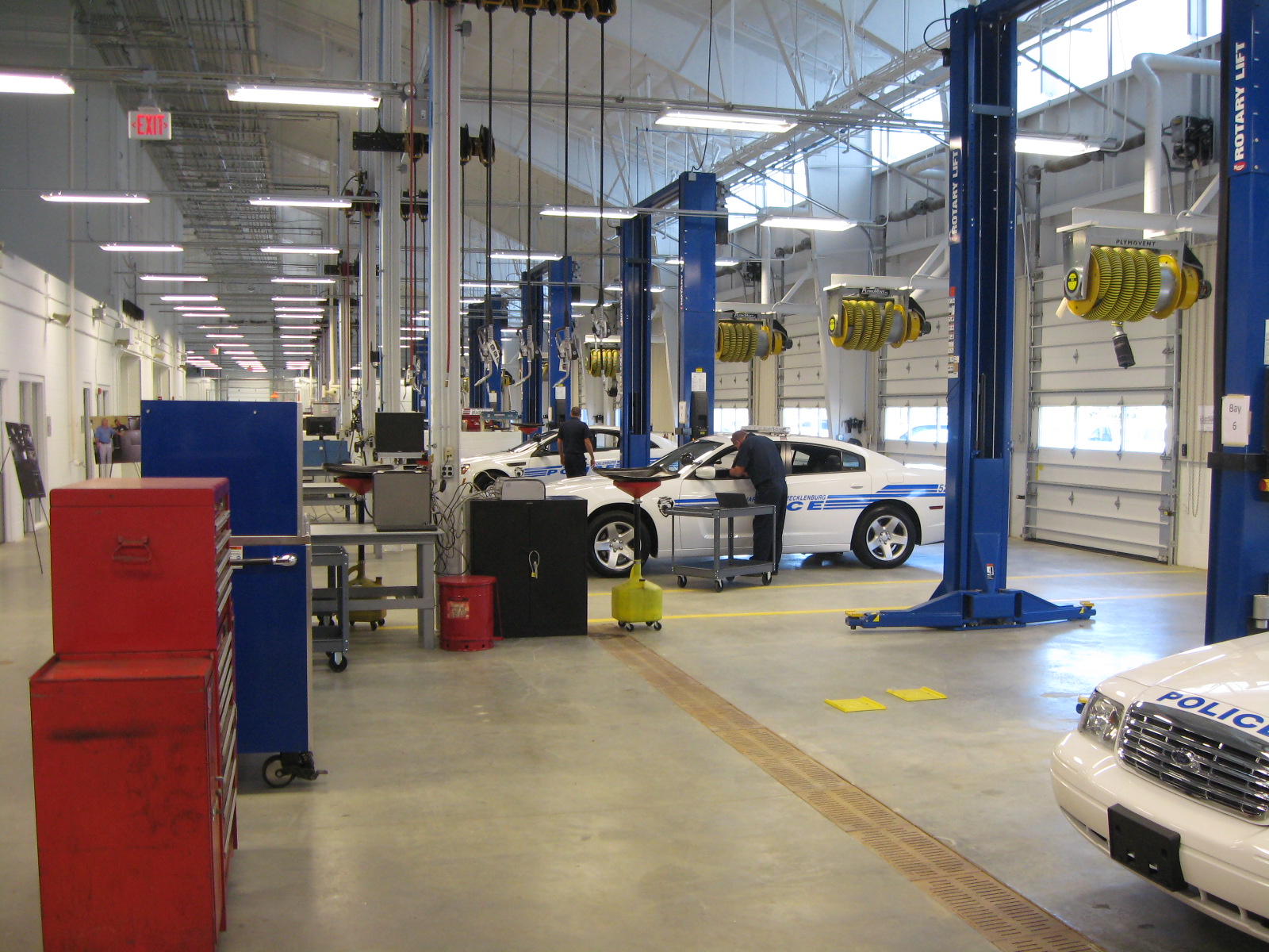 Charlotte police cars being serviced in maintenance facility